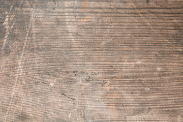 Fototapeta na wymiar Dark texture of old natural wood with cracks from exposure to sun and wind