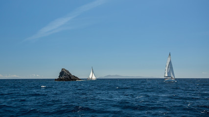 Obraz premium Sailing ship luxury yacht with white sails in the Sea.