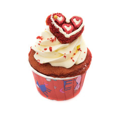 Chocolate cupcake decorated with red heart icing and sprinkles isolated on white
