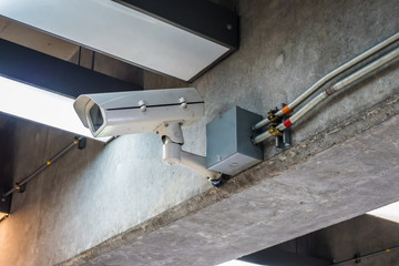 Security CCTV camera on the cone of the modern building in airport