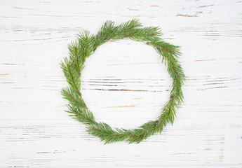 Christmas Round Frame with fir tree, on rustic wood.