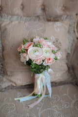 Elegant wedding flower bridal bouqet on texture sofa