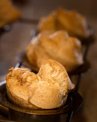 Golden brown popovers in pan with shallow focus