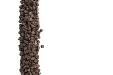 Chocolate Chips in Vertical Row on Isolated White