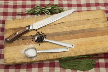 Knife on cutting board for meal preparation ideas in kitchen and home cooking..  Copy space for text.