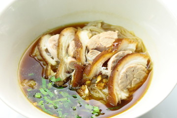 White noodle and softy pork leg in Thai style soup