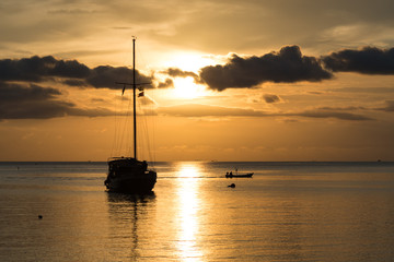 Twilight scene of boat with cloudy sky