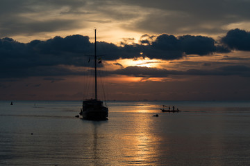 Twilight scene of boat with cloudy sky