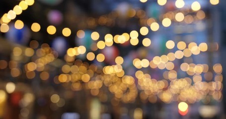 Abstract blurred bokeh hanging lights in a large city.  	 - Powered by Adobe