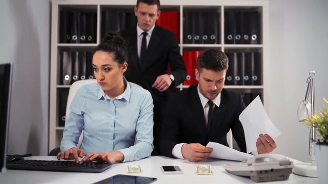 Handsome Boss businessman collect some money from his employee visual. Like per cent from salary. He put it in pocket and go away. Sad collegues injustice. 4k ultra hd.