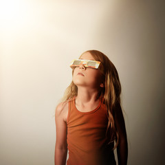 Child Looking Up at Solar Eclipse