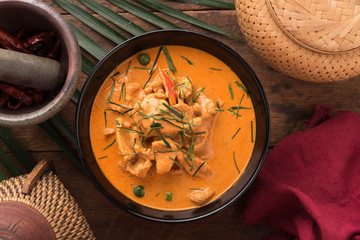 Red Curry with pork on wooden table, Thai food.