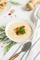 Mushrooms chanterelle cream soup on white background