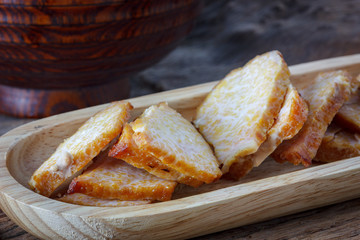 Roasted pork with spices on wooden board
