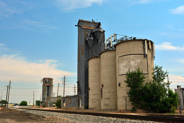 Cell Tower on an Old Antique Agricultural Grain Elevator Silo with Railroad Tracks