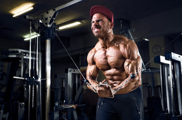 Fototapeta na wymiar Bodybuilder hard workout for chest muscles