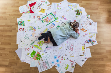 Student lays faces down over her whole year homework