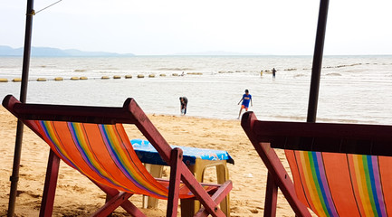Canvas bed on a wooden chair on the beach