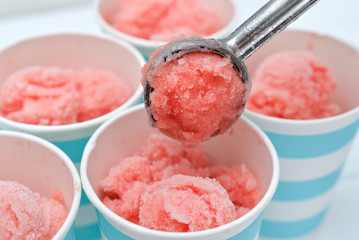 Homemade watermelon sorbet in blue paper cup