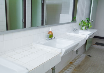 chrome faucet old on white sink in the bathroom with copy space add text