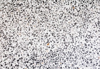 terrazzo floor old texture which has gravel stone black and gray white cement for background with copy space add text
