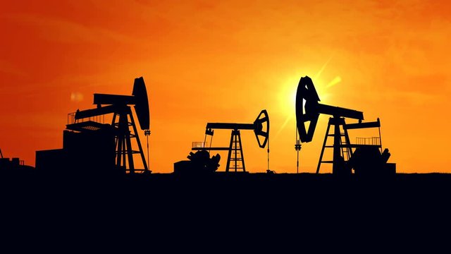 Oil pump oil rig energy industrial machine for petroleum in the sunset