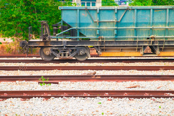Fototapeta na wymiar track and train dirty cargo parking At the station with copy space add text. select focus with shallow depth of field