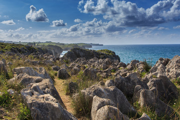 Rocks on the coast with clouds. Nature elements concept © Rafa