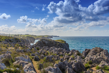 Rocks on the coast with clouds. Nature elements concept © Rafa