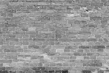 Old and aged brick wall texture background in black and white.