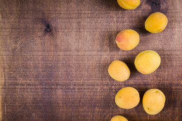 Apricots on a wooden table.