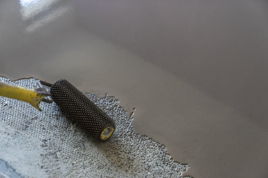 Interior of apartment under construction. Floor covering with se