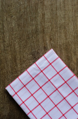 the checkered tablecloth on wood table