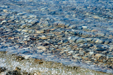 pebble stones into the water