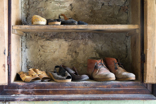 Wardrobe full of old shoes.
