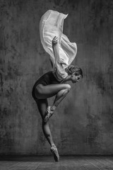 Young beautiful dancer is posing in studio - 168284396