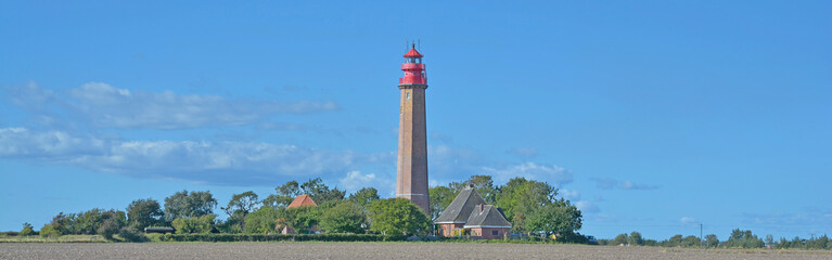 der Leuchtturm von Flügge auf der Insel Fehmarn,Ostsee,Schleswig-Holstein,Deutschland - obrazy, fototapety, plakaty