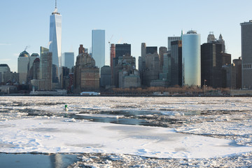 Obraz na płótnie Canvas Frozen NYC Skyline; Rare Ice-covered Hudson River; Winter Polar Vortex 2015; Climate Change
