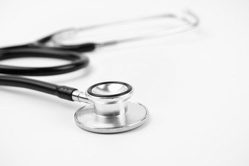 Close up view of black stethoscope on white isolate background