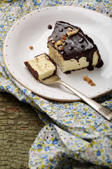 Slice of Chocolate cheesecake with walnuts