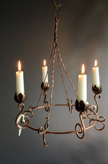 Copper advent wreath with lights.