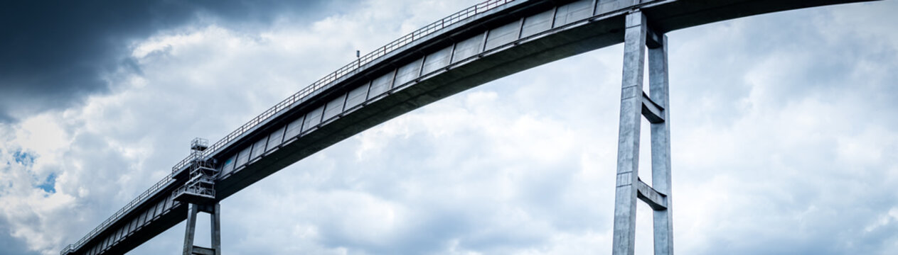 Fototapeta High iron rail bridge. Dramatic panoramic background.