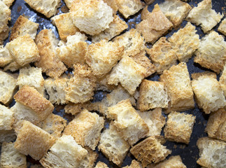 Dark background iron baking sheet crackers bread crumbs