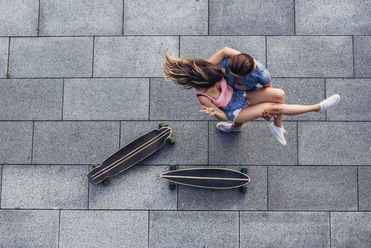 Young couple outdoors - Powered by Adobe