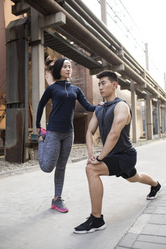 Young couple exercising outdoors