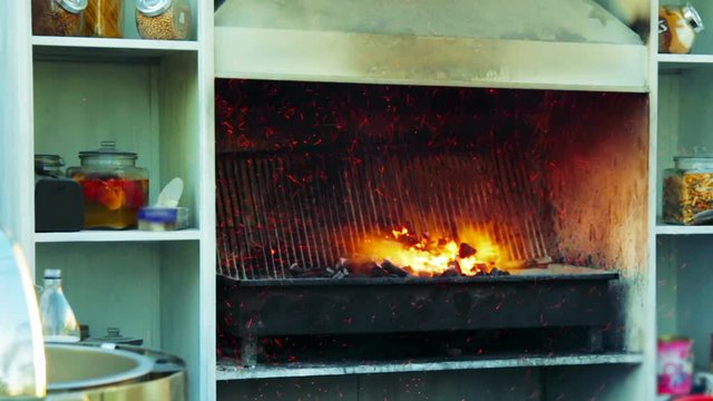 Cinemagraph of fire and sparks in the grill
