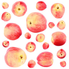 Different ripe red peaches, isolated, top view © lisssbetha