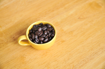 Cup full of coffee beans