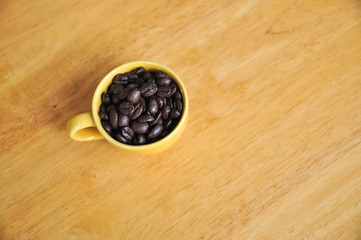 Cup full of coffee beans