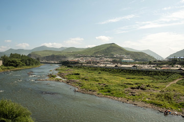 Hyesan in Ryanggang province of North Korea. The city has a population of approximately 200.000 and is set on the bank of the Yalu river on the border to Changbai, China.